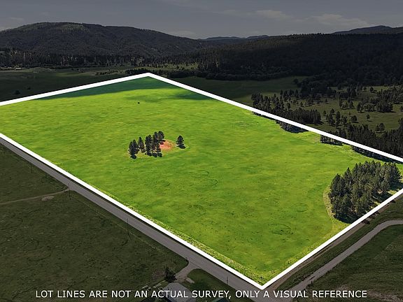 Same aerial of the parcel with white lot lines drawn over the outline of the 120 acres as a visual reference, not a survey